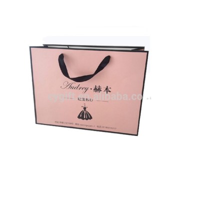 Do you like Yiwu factory hot sale custom pink shopping slogan European paper bag for clothes